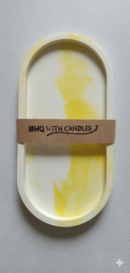 Yellow and white marbled candle in a decorative holder with 'HQ with Candles' label on a gray background
